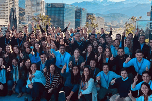 Advantage Awards recipients celebrating together at a company event with award badges displayed