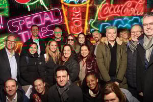 Our team gathered at a branded experiential event, representing collaboration and shared achievement.